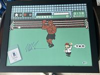Full view of framed 18×22 Punch-Out poster with Mike Tyson signature and Beckett certificate card inside frame