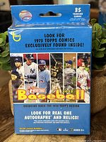 Front view of the sealed 2022 Topps Heritage Baseball box, highlighting player images and promotional text for autographs and relics.