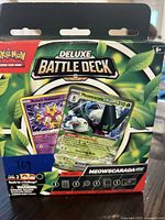 Front of boxed Pokémon Deluxe Battle Deck showing title, Meowscarada EX and Radiant Alakazam artwork