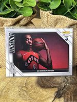 Front side of the Scottie Barnes NBA rookie trading card showing player image, Raptors uniform, and Panini Instant logo.