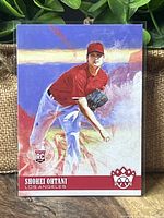 Front of the 2018 Donruss Diamond Kings Shohei Ohtani rookie pitching baseball card showing artwork of Ohtani in red Angels pitching uniform with a red border.