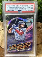 Front of 2022 Topps Cosmic Chrome Vladimir Guerrero Jr. Launched Into Orbit die-cut card in PSA graded slab showing grade PSA 10 GEM MT with serial number.