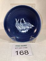 Front view of small porcelain serving bowl showing cobalt blue interior with painted geese design