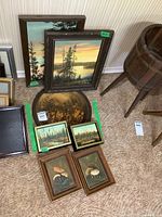 View of 7 framed paintings on board by artist Marya, showing landscape and mushroom subjects with visible signatures.