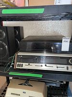 Front view of Webcor stereo system with turntable and pair of Yorx speakers on sides.