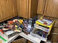 Wide view of the tools and organizer on a countertop with multiple hand tools strewn around