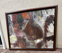 Frontal view of the large framed abstract painting showing color composition and framing.