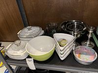 Full view of all items including casserole dishes, mixing bowls, ceramic bowls, and candlesticks