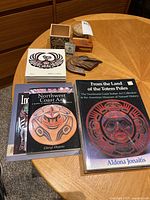 Overview of all items in the lot including books and decor