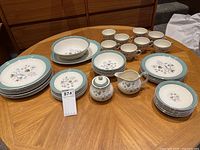 Full view of Midwinter Stylecraft Mayfield dinner set arranged on table with plates, cups, saucers, serving bowl, platter, creamer, and sugar bowl.