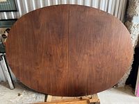 Close-up of tabletop surface showing walnut veneer and wood grain