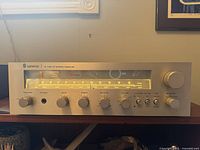 Front view of the Sherwood S-7150 CP stereo receiver showing illuminated tuning dial and control knobs.