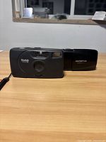 Front view of Kodak and Olympus cameras side by side