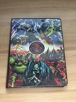 Front cover of the Chaotic binder showing vibrant fantasy artwork with different creatures surrounding the Chaotic logo.
