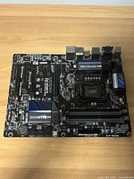 Front side of the GIGABYTE GA-Z87-D3HP motherboard showing multiple PCIe slots, RAM slots, heatsinks, and ports.