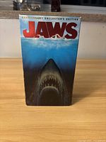 Front of the original Anniversary Collectors Edition VHS box showing the Jaws logo with shark underwater image