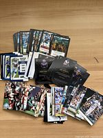 Photo of a spread of football sports cards including player action shots and season ticket style cards.