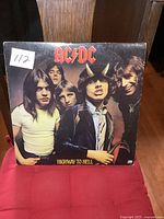 Front cover of AC/DC Highway to Hell album in used condition showing band photo and album title.