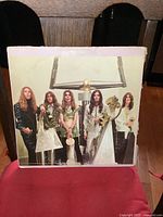 Front cover of Alice Cooper LP showing band members and album artwork.