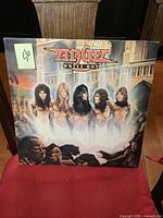 Front cover of Angel White Hot vintage LP album with illustrated band members.