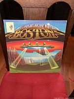 Front cover of Boston Dont Look Back vinyl album, showing colorful spaceship art and Boston logo.