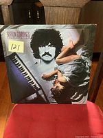 Front cover of vintage vinyl LP album showing artist Burton Cummings portrait, keyboard instrument, and woman in dress lying down.