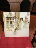 Front cover of Cheap Trick Dream Police LP showing band members in white police uniforms and title text.