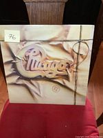 Front cover of Chicago 17 vinyl album showing band logo and 3D string design.
