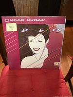 Front cover of Duran Duran 'Rio' vinyl LP album showing stylized illustration of a woman's face and the album title.