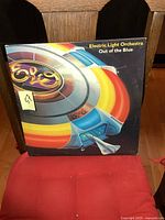 Front cover of the Electric Light Orchestra Out of the Blue LP showing colorful spaceship design and ELO logo