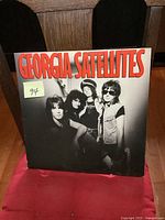 Front cover of the Georgia Satellites vintage LP showing band photo and title in large red print.