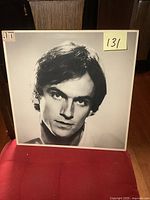 Front cover of the James Taylor LP showing a black and white portrait with initials JT.