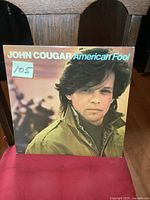 Front cover of John Cougar's American Fool album showing the artist's portrait and title.