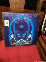 Front cover of Journey Frontiers vinyl LP showing robotic blue face artwork