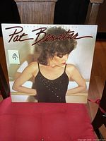 Front cover of Pat Benatar Crimes of Passion LP album, featuring the artist looking sideways in a black top with rhinestones