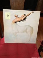 Front cover of Roger Daltrey's Ride a Rock Horse vinyl LP showing centaur image and minor surface wear.