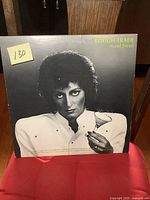 Front cover of Rough Trade 'Avoid Freud' vinyl LP showing woman holding a martini glass.