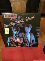 Front cover of the Soft Cell Non Stop Erotic Cabaret LP showing the band members and album title.