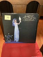 Front cover of Stevie Nicks Bella Donna vinyl LP showing female figure in white dress holding a white dove