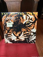 Front cover of the Survivor Eye of the Tiger vintage LP album with tiger's face graphic and title text.