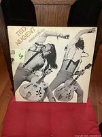 Front cover of the Ted Nugent Free For All LP album showing the artist in dynamic pose with guitar.