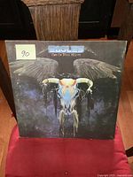 Front cover of The Eagles 'One of These Nights' vinyl album showing winged skull artwork