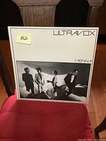 Front cover of Ultravox Vienna vinyl LP album showing the band standing in stylish black and white photo with album title and band name in minimalist font.