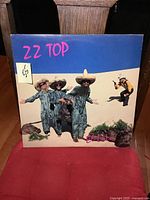 Front cover of ZZ Top El Loco vinyl LP showing band members in themed costumes
