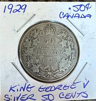 Reverse side of the 1929 Canadian 50 cent coin showing denomination, date, maple leaf wreath and crown.
