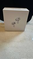 Front of unopened white AirPods Pro box showing product image