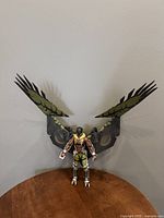 Front view of the Vulture figure standing with wings fully extended showing detailed suit paint and wing design.
