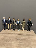 Front view showing all six Marvel Legends MCU figures lined up side by side against a dark gray background.