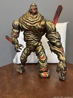 Front view of complete Molten Man figure showing detailed rocky and molten paint, articulated limbs, and translucent red energy pieces.