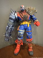 Front view of the Marvel Legends Spider-Man cyborg action figure showing full body with spiked armor and mechanical arm.